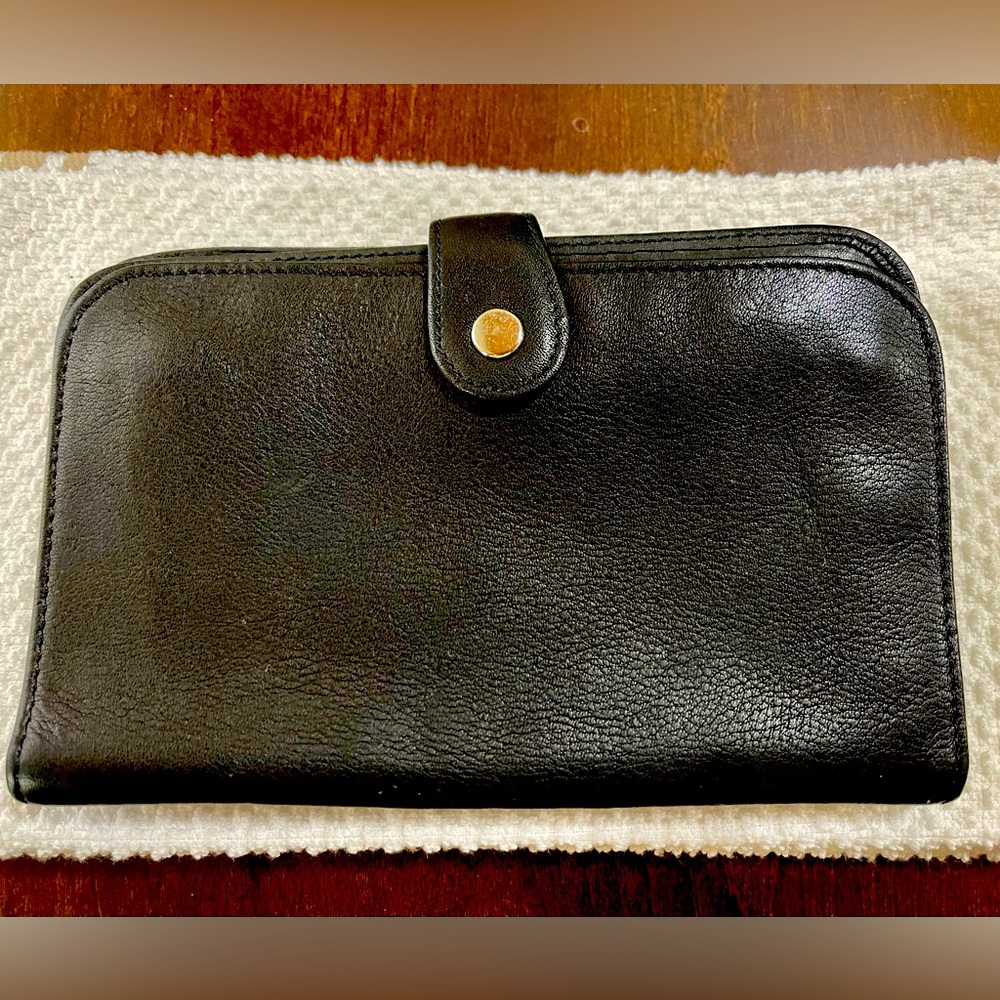 Wilson’s genuine leather wallet. 6.5” x 4.5”.